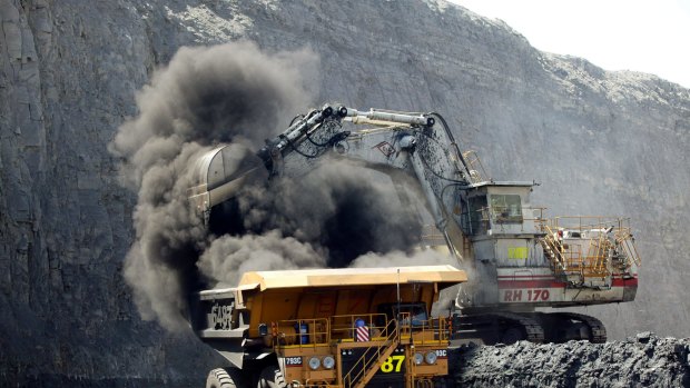 BHP Billiton is looking at buying some Queensland coalmines as the market ticks higher.