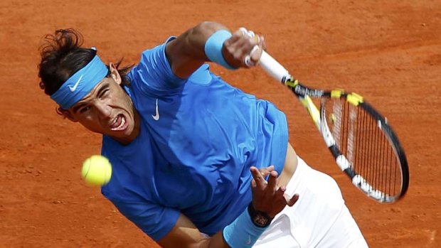 Dominant: World No. 1 Rafael Nadal on his way to a 6-1, 6-3, 6-0 win over Croatian qualifier Antonio Veic at Rolland Garros yesterday.
