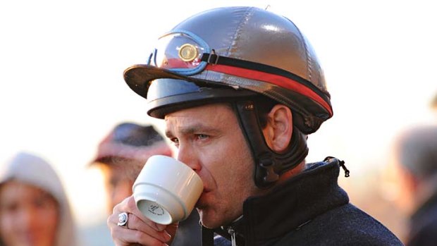 Jockey Danny Nikolic gets in a quick cuppa before his rides.