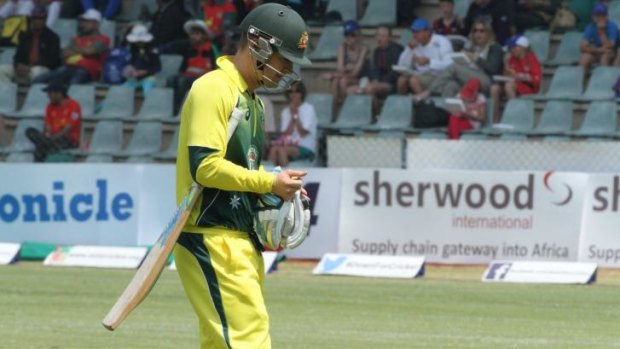 Clarke retires hurt during Australia's loss to Zimbabwe in Harare on Sunday.