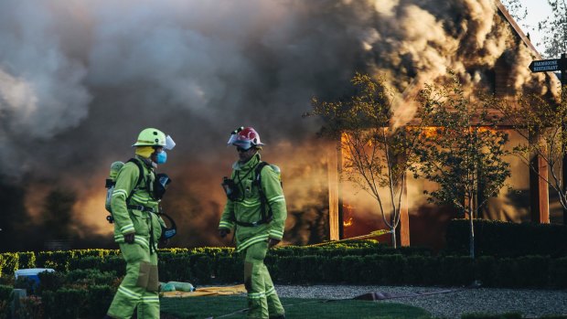 Emergency services work to extinguish the fire at Pialligo Farmhouse Restaurant.