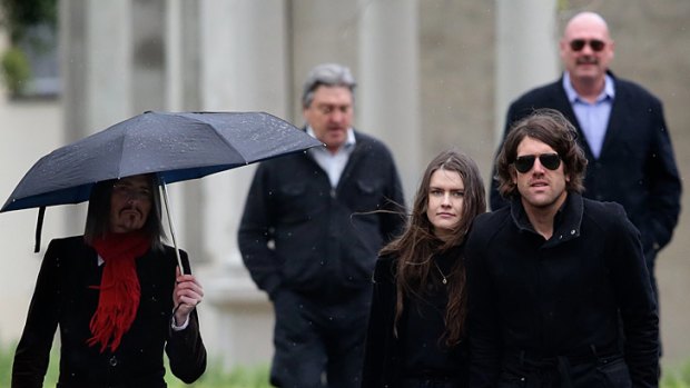 Mourners gather in Fitzroy to farewell Mark Chopper Read on Thursday afternoon.