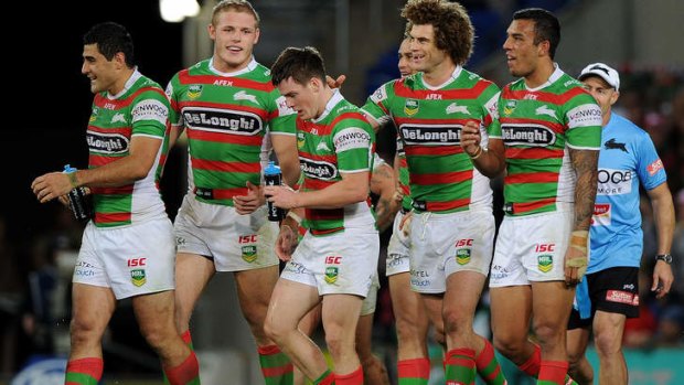 Relishing the task: Luke Keary (centre) celebrates a try with South Sydney teammates.