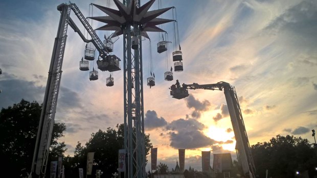 The London Fire Brigade uses cherry-pickers to save 19 people stuck on a fairground ride on the South Bank in central London on Sunday.