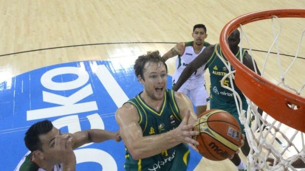 Boomers guard Brad Newley drives through the Mexico defence.