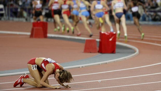 Sad end ... Morgan Uceny reacts after falling during the women's 1500m.