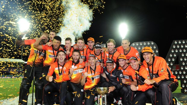 Scorching: Perth Scorchers celebrate with the trophy after winning the T20 Big Bash League in a  thriller over the Sydney Sixers in Canberra.
