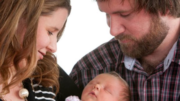 "Overwhelming" ... one-week-old Charley Randall was conceived naturally while her mother Meagan Randall, pictured with husband Adam, was conceived using IVF 26 years ago.