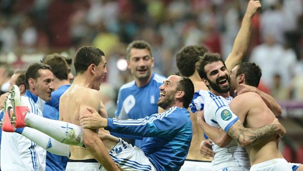 Greek players celebrate after defeating Russia.