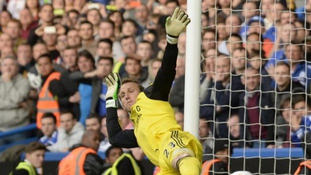 Calamity: Mark Schwarzer fails to save a penalty during Chelsea's shock loss to Sunderland in the English Premier League.