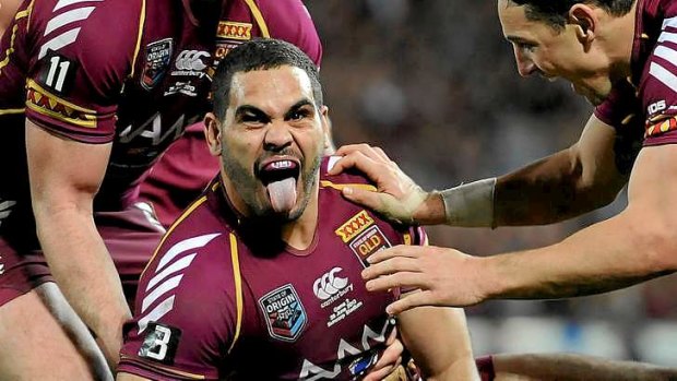 Appetite for destruction: Like many, Maroons captain Cam Smith can only watch and admire the devastating impact Greg Inglis has on a football field.