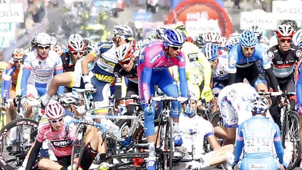 Last man standing: A crash marred the finish to stage three of the Giro d'Italia, won by Australia's Matt Goss.
