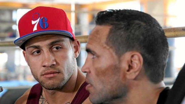 Donning the gloves: Blake Ferguson (L) with his cousin Anthony Mundine.