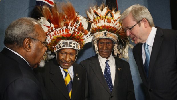 Prime Minister Kevin Rudd and his PNG counterpart  Sir Michael Somare  with "Fuzzy Wuzzy Angels" Dickson Hango and Wesley Akove in Canberra yesterday.
