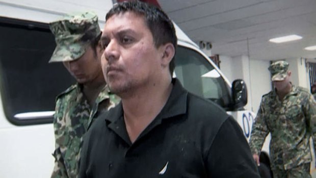"Sadistic": Miguel Angel Trevino Morales is escorted by marines after his capture.