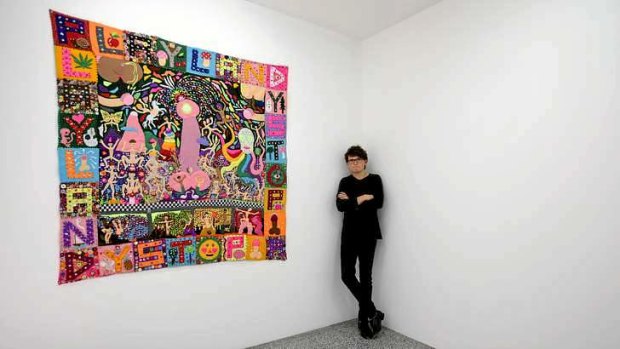 Melbourne artist Paul Yore with a piece from his latest show, <i>Fountain of Knowledge</i>.