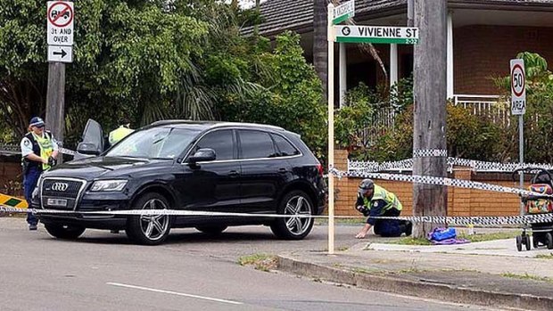Site of tragedy ... police examine the scene at a Kingsgrove Road side street on Tuesday.