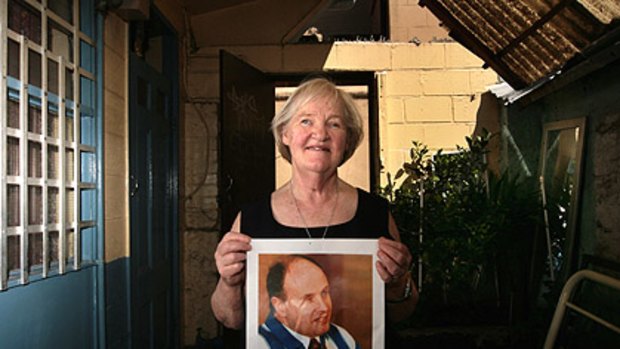 Margaret Tomkins, with a photo of her lifelong friend Morris "Monty" James.