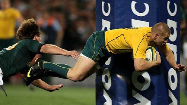 Drew Mitchell dives over to score the Wallabies fifth try.