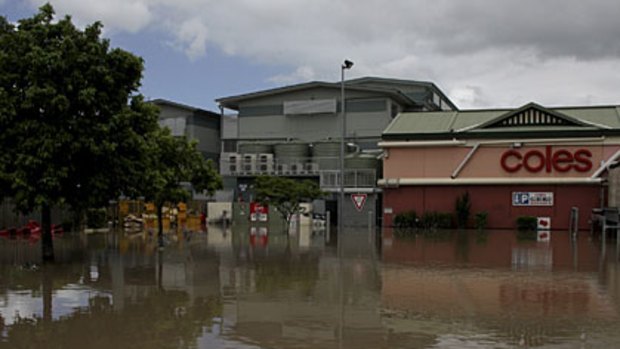 The New Farm Coles surrounded by floodwaters.