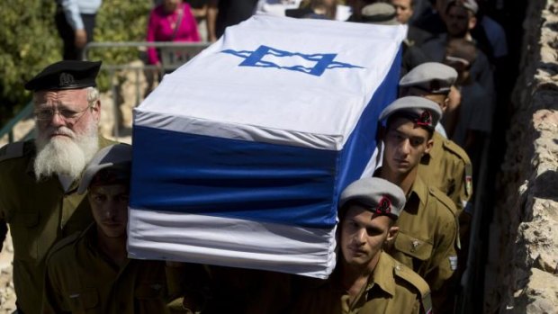 Israeli soldiers carry the coffin of Staff Sgt. Amit Yeori, 20, during his funeral at the Mount Herzel military cemetery in Jerusalem on Sunday.