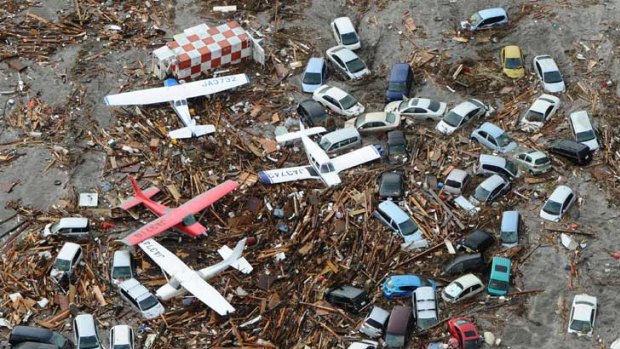 Sendai airport was awash with light planes, vehicles and the remains of houses and other buildings after the tsunami swept through the region.