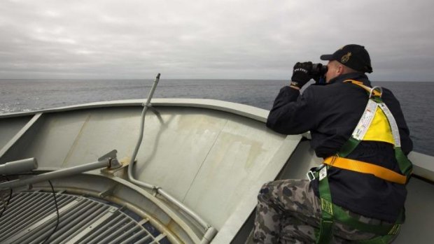 The search continues ... a lookout is stationed on bow of HMAS Success during the search in the southern Indian Ocean for signs of the missing Malaysia Airlines Flight MH370.