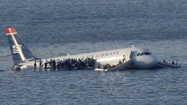 Passengers stand on the wings of a US Airways plane after it landed in New York's Hudson River in 2009.