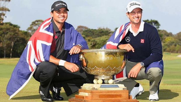 Jason Day and Adam Scott after winning the World Cup at Royal Melbourne.