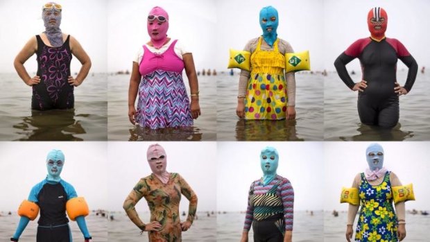In this composite image Chinese women pose in facekinis in the Yellow Sea in Qingdao, China.  The locally designed mask is worn by women to protect them from jellyfish stings, algae and the sun's ultraviolet rays.