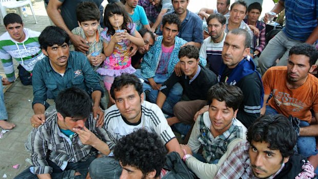 Human misery: A group of people rescued by the Australian Navy from a boat that sank near Indonesia on Thursday, then returned to Indonesia.