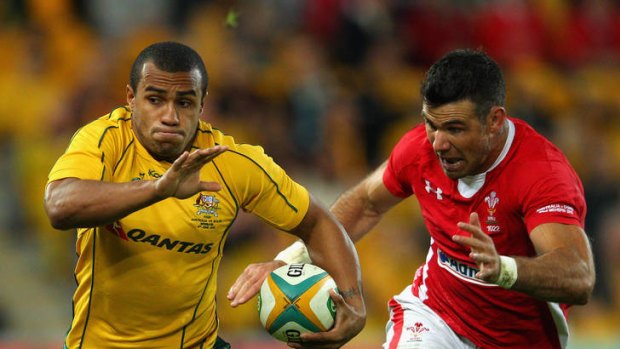 Streets ahead ... Will Genia of the Wallabies running the ball against Wales.