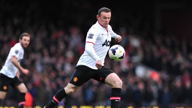 Key to England's chances: Wayne Rooney gets set to strike for goal.
