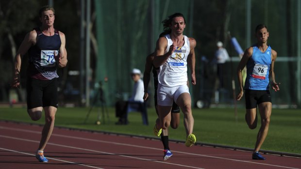 Joshua Clarke (centre) speeds into the Olympic team with a 10.15-second effort at the AIS.