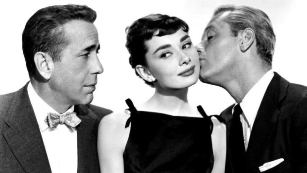 Humphrey Bogart, Audrey Hepburn and William Holden in the romantic comedy <i>Sabrina</i>.