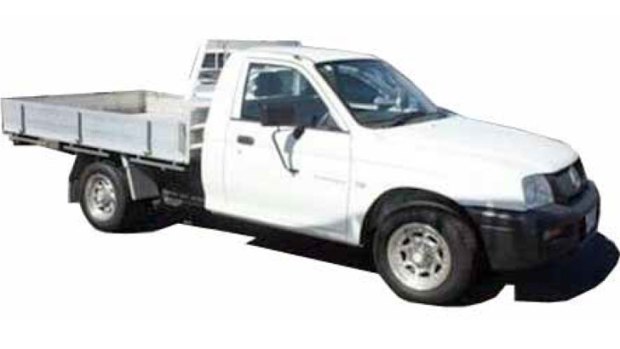 Police are searching for a white 2004 Mitsubishi tray back utility vehicle similar to the one above.