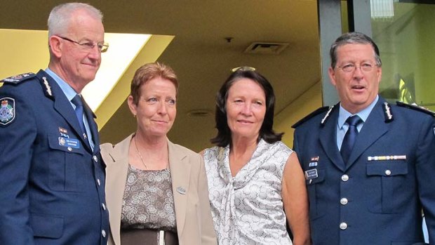 Outgoing police commissioner Bob Atkinson, with his partner Glenda, and his relacement Ian Stewart, with wife his Carol.