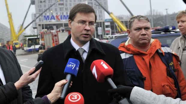 Taking responsibility ... Latvia's Prime Minister Valdis Dombrovskis speaks to press outside the collapsed supermarket shortly after the disaster in Riga, Latvia.