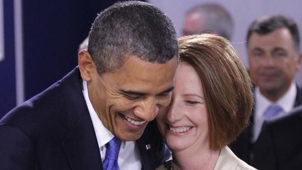 A laugh and a joke ... US President Barack Obama greets Australia Prime Minister Julia Gillard.