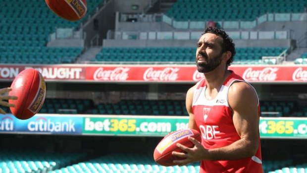 Putting pressure on the selection committee: Adam Goodes does some ball work during training.