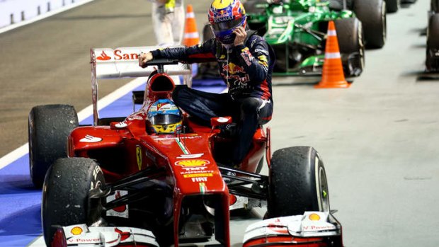 Mark Webber is given a lift back to the pits by Fernando Alonso during the Singapore Grand Prix in September. Throughout his F1 career, the tall Webber struggled to shed weight to compete in cars designed for lighter drivers.