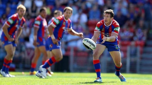 Playing for Alex: Knights captain Kurt Gidley gets a pass away against the Sharks.