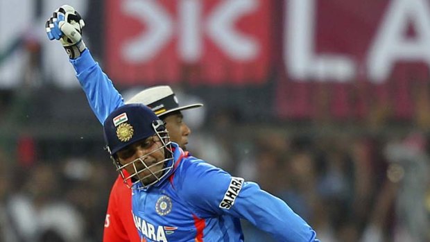 Record score ... Virender Sehwag celebrates after reaching 200.