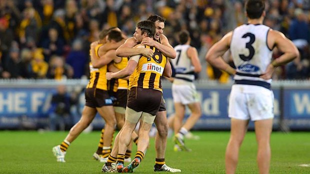 Happy Hawks: Brent Guerra (No.18) celebrates the thrilling win over Geelong.