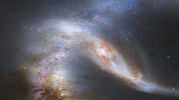 The sky is seen at night just before the predicted merger between our Milky Way galaxy and the neighbouring Andromeda galaxy, in this NASA photo illustration released May 31, 2012.