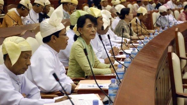 Burma's Opposition Leader Aung San Suu Kyi took her place in parliament for the first time yesterday as an elected representative.