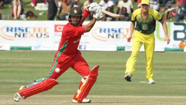 On the front foot: Zimbabwean batsman Sikandar Raza sends one to the boundary.