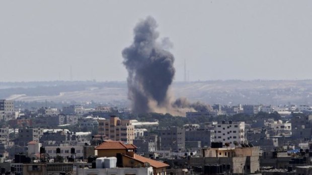 Attacks continue ... Smoke rises after an Israeli missile strike in Gaza City on Tuesday.