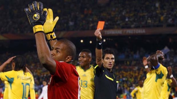 Sent off .... referee Massimo Busacca shows a red card to South Africa goalkeeper Itumeleng Khune