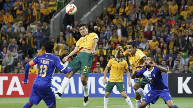 Massimo Luongo (second left) heads home the Socceroos' second goal.